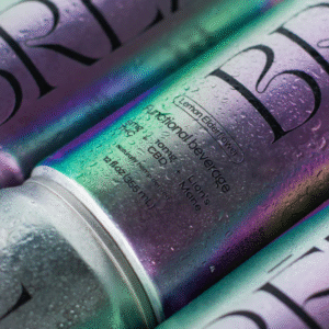A close-up view of multiple irradiated BREZ Lemon Elderflower Functional Beverage cans covered in condensation.